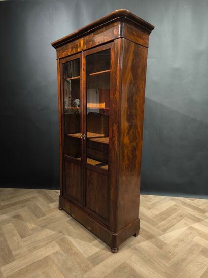 Mahogany and mahogany veneer bookcase, opening...