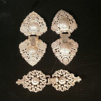 Set of three silver cape buckles or coat...