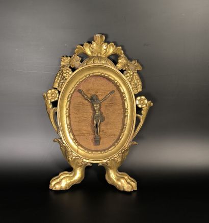 Small Christ in a gilded wood frame decorated...