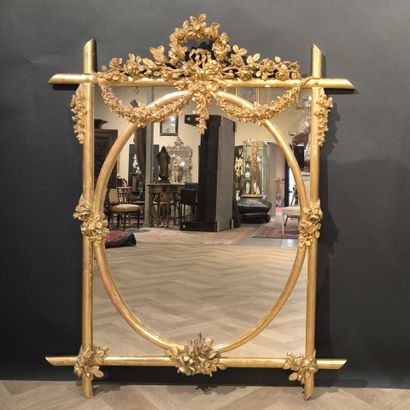 Wood and gilded stucco glazed mirror, decorated...