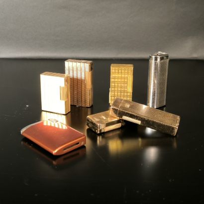 S.T. DUPONT. 2 lighters: gold-plated guilloché,...