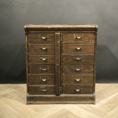 Small mail cabinet opening with 12 drawers...