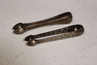 Two silver sugar tongs, one openwork with...