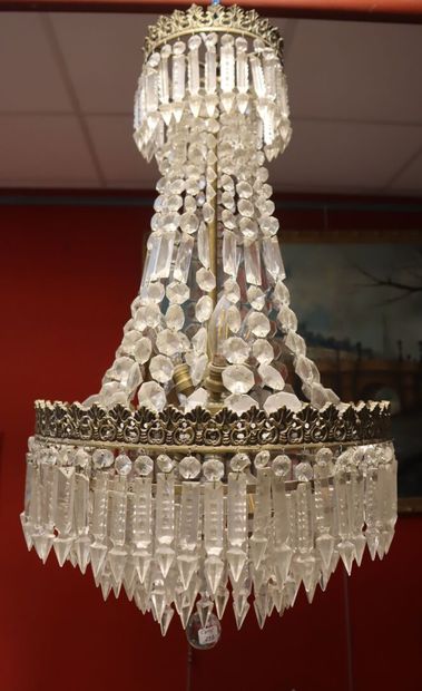 Metal and gilded brass chandelier decorated...