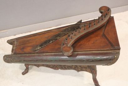 Celempung 
in carved wood and polychrome...