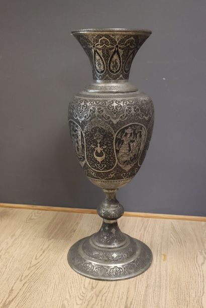 Large metal baluster vase with repoussé decoration...