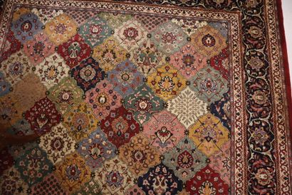 Wool carpet with flower and vase design on...