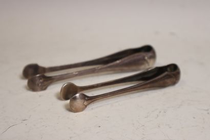 Two silver sugar tongs, one openwork with...