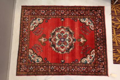 Wool carpet 
with red background and geometric...