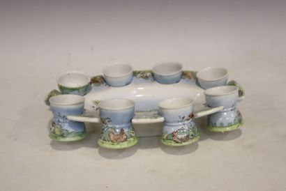 Earthenware egg service with historiated...