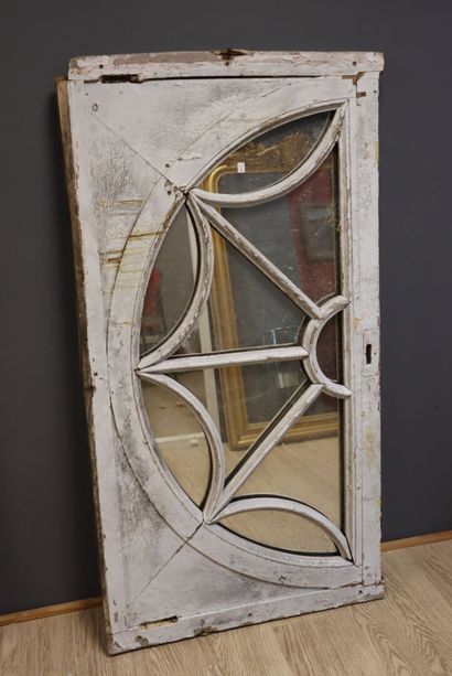 White lacquered molded wood door top with...