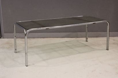 Coffee table with glass top mounted on a...