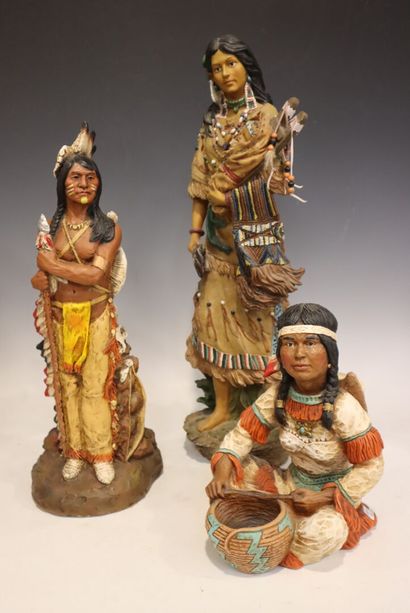 Three painted resin figures of Indians 
H....