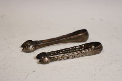 Two silver sugar tongs, one openwork with...