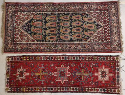 Two carpets 
- a Kadjar carpet decorated...