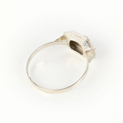White gold ring set with a small white stone....
