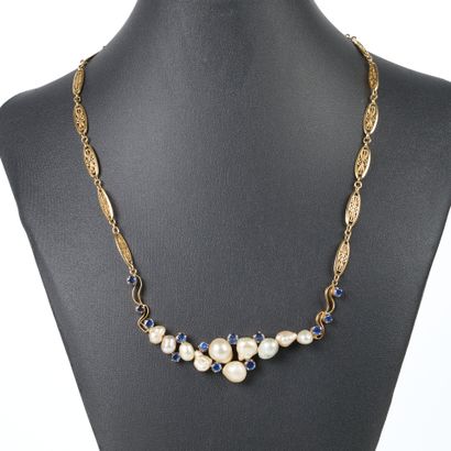 Gold necklace, filigree-link chain holding...