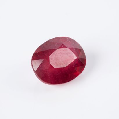 On paper, an oval-cut ruby weighing approx....