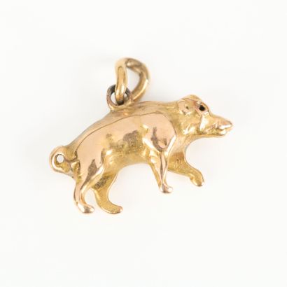 Small gold charm with pig design. Length...