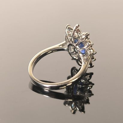 Ring centered on an oval-cut natural Ceylon...