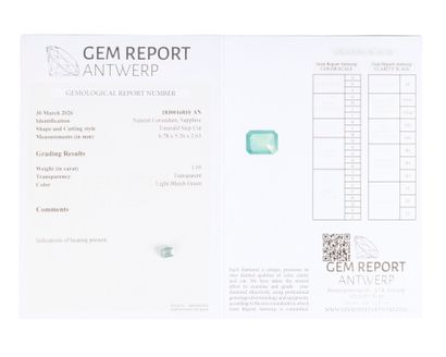 Blue-green emerald-cut sapphire on paper...