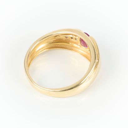 Gold ring set with an oval-cut ruby and 6...