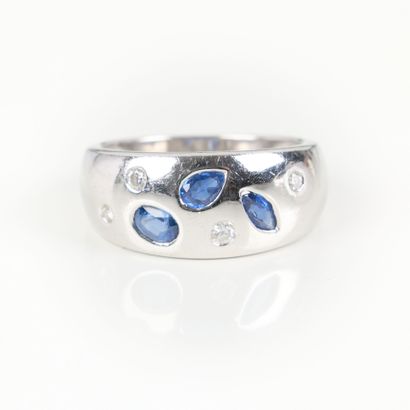 White gold ring set with three sapphires...