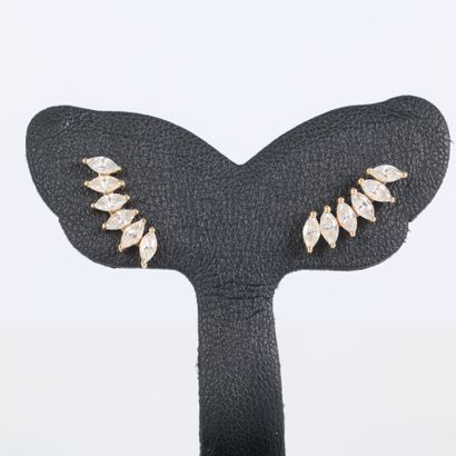Pair of gold stud earrings each set with...