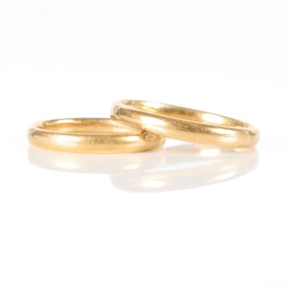 Two unengraved gold wedding bands. TDD 52...