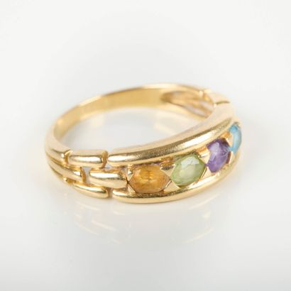 Gold band ring set with 4 oval gemstones....