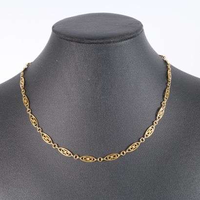 Gold necklace, oval link and curb chain at...
