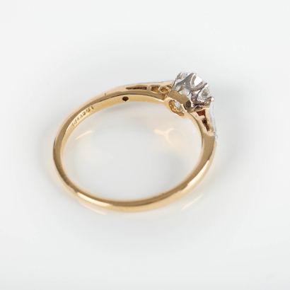 Fine two-tone gold solitaire ring set with...