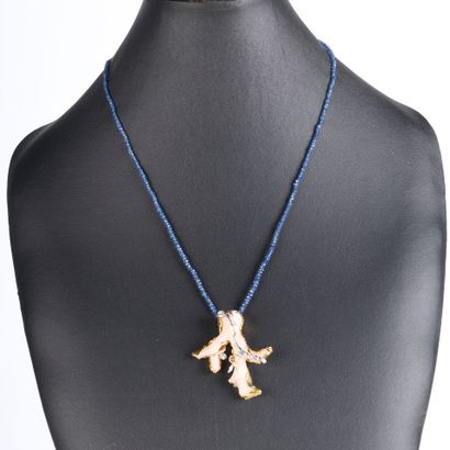 Two-tone gold pendant set with a coral and...