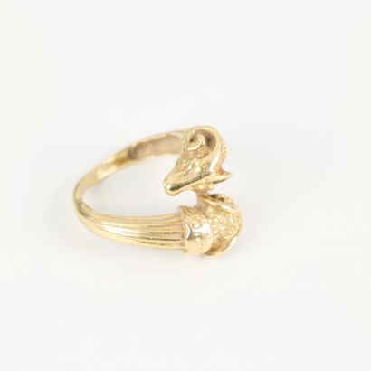 Gold ring featuring interlocking ram heads...