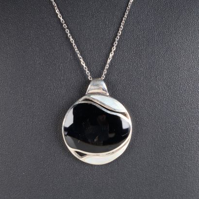 Solid silver pendant set with a stylized-cut...