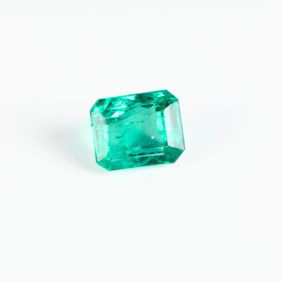 On paper, a pan-cut emerald weighing approx....