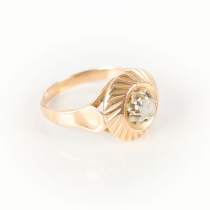 Two-tone gold ring set with a white stone....