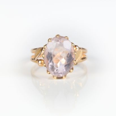 Rose gold ring set with an oval blue semi-precious...