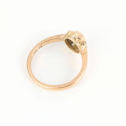 Gold daisy ring, set with a sapphire in a...