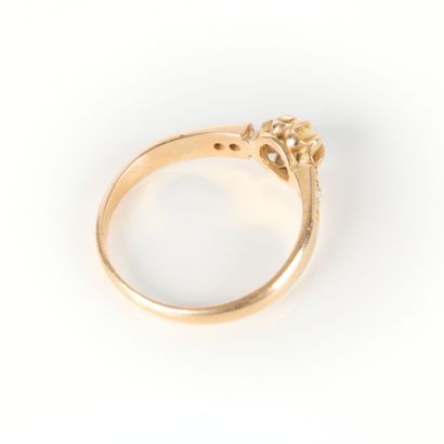 Pink gold ring set with a half-pearl and...