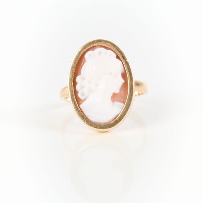 Gold ring set with a shell cameo engraved...