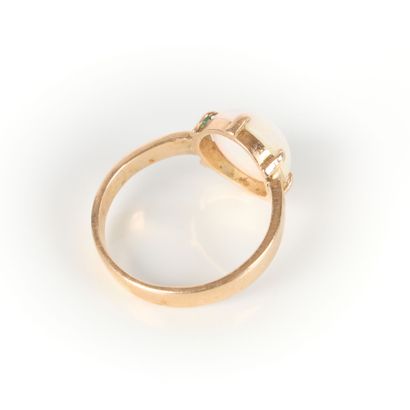 Rose gold ring set with a round cabochon...