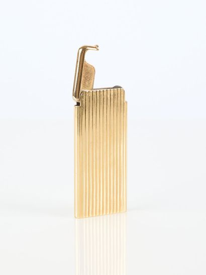 REPOSSI. Gold and engraved metal lighter....