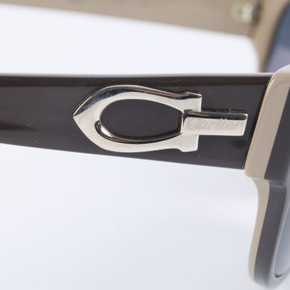 CARTIER. Pair of black and grey plastic sunglasses...