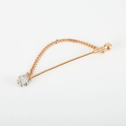 Two-tone gold pin set with an old-cut diamond...