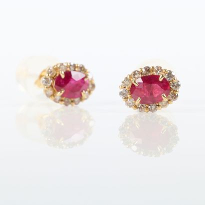 Pair of yellow gold (750‰) ear studs, each...