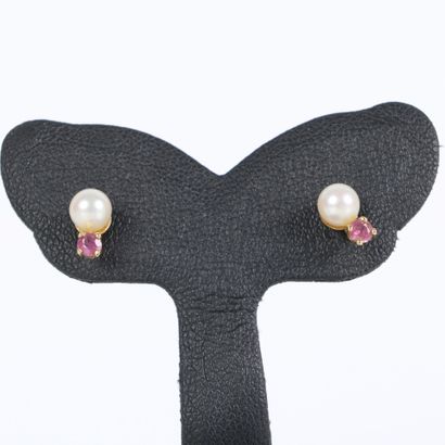 Pair of gold (750‰) ear studs, each set with...
