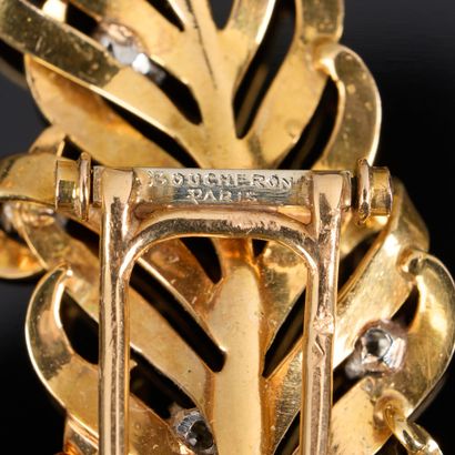 BOUCHERON. Two-tone gold feather brooch set...
