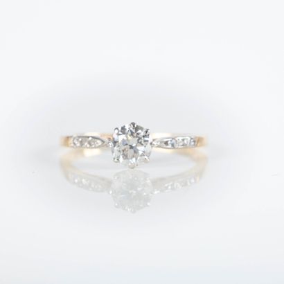 Fine two-tone gold solitaire ring set with...