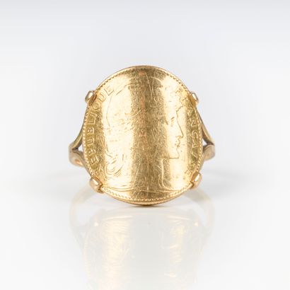 Gold ring set with a 10 FF rooster coin....